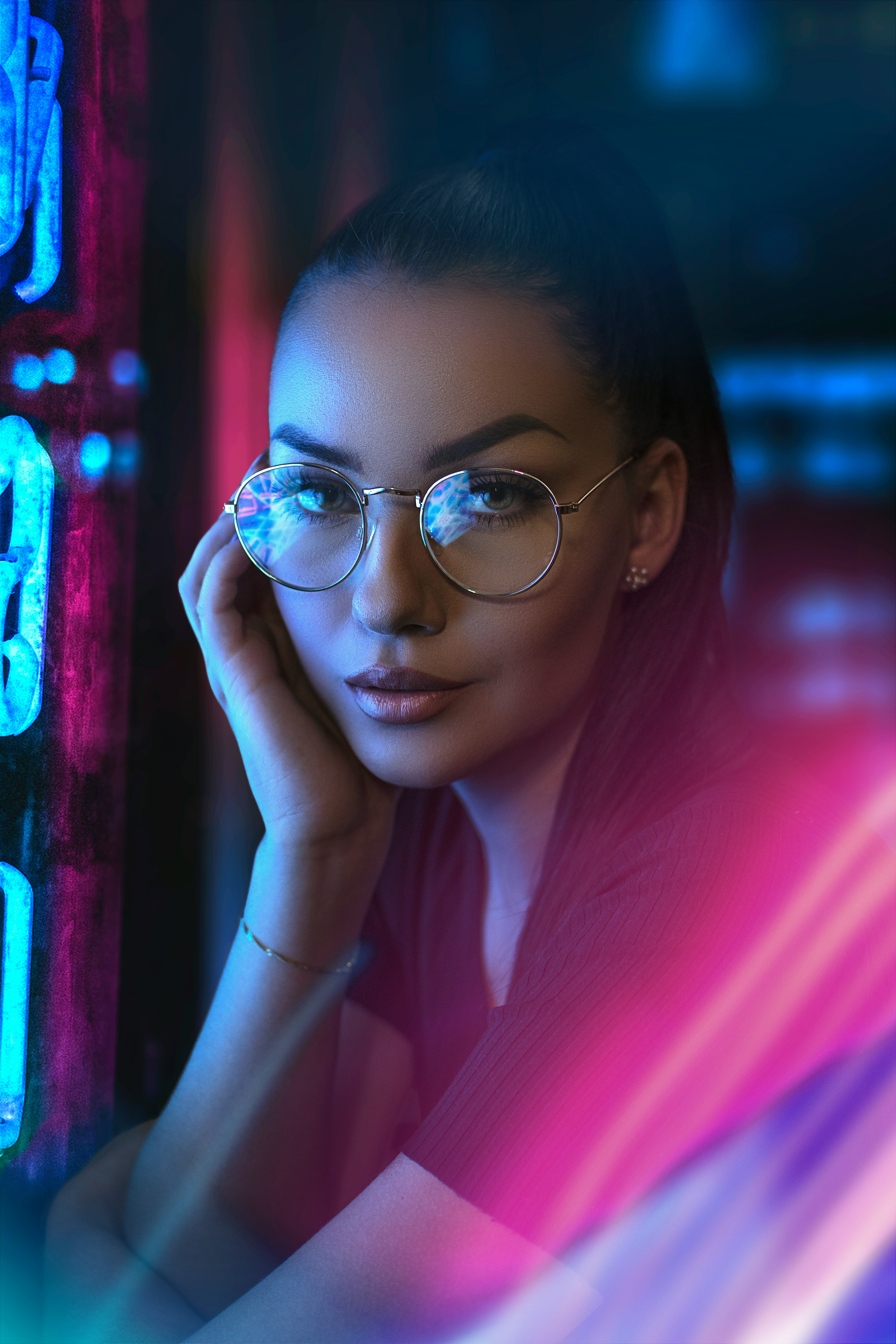 woman in white shirt wearing black framed eyeglasses